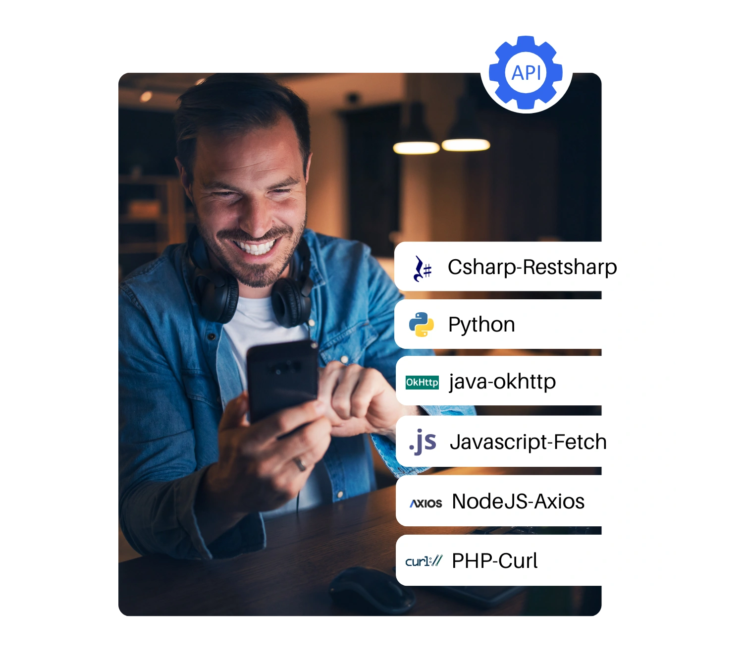 A smiling man using a smartphone